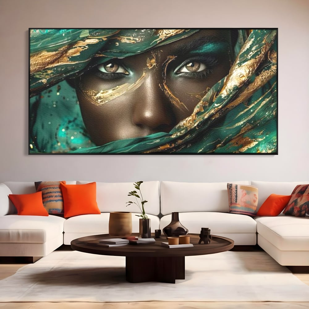 Tablou canvas cu portret artistic cu ochi caprui si tesatura verde, in rama de aluminiu negru, pe perete intr-un living